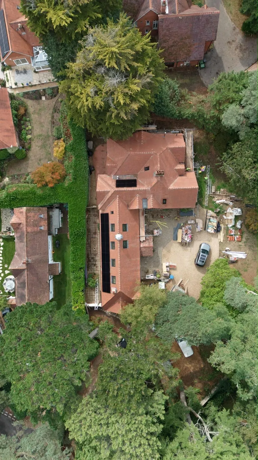 Wide aerial view of the Dover Road roofing project and its tree-lined setting in Branksome Park, Dorset
