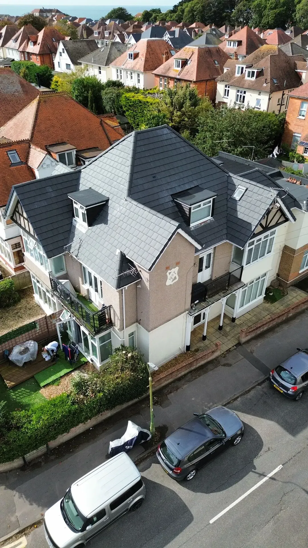Aerial view of the Southbourne roof replacement with dark Crest Planum tiles