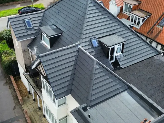 Finished roof replacement with flat roof detailing