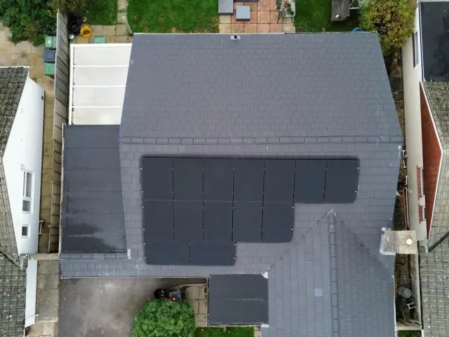 Aerial Solar Panel Installation in Bournemouth Aerial view of a residential solar panel installation on a tiled roof in Bournemouth by Up Top Solar