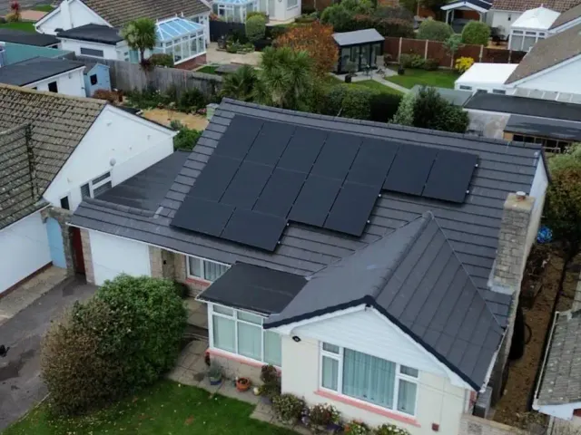 Bungalow Solar Panel Installation Drone view of solar panels installed on a bungalow roof in Bournemouth by Up Top Solar