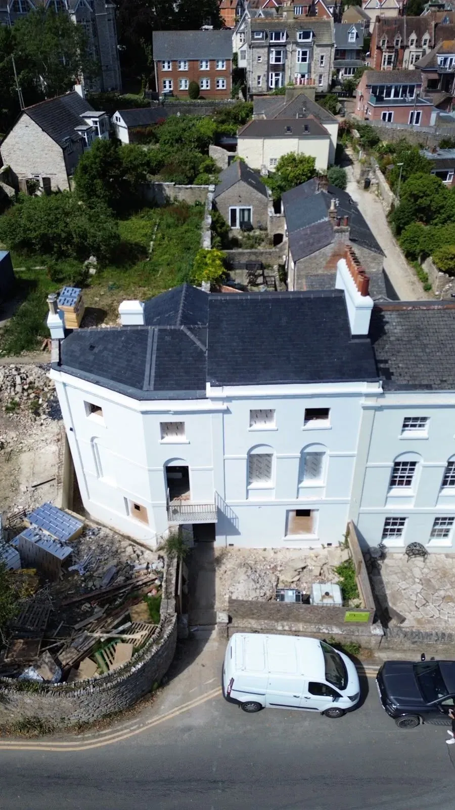 Front elevation of a completed natural slate re-roof in Swanage