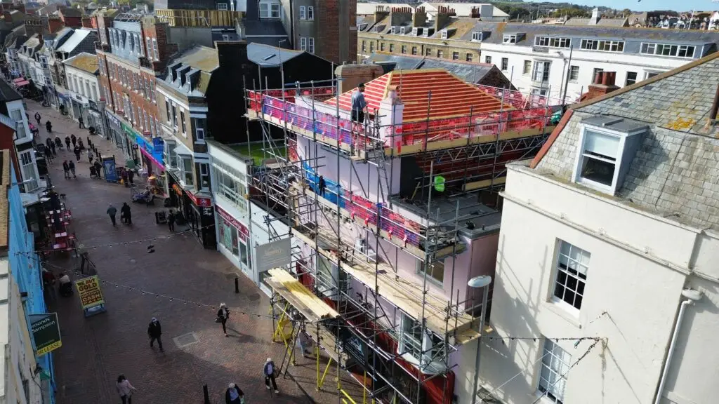 Roofers installing battens and breathable membrane during Weymouth roof replacement