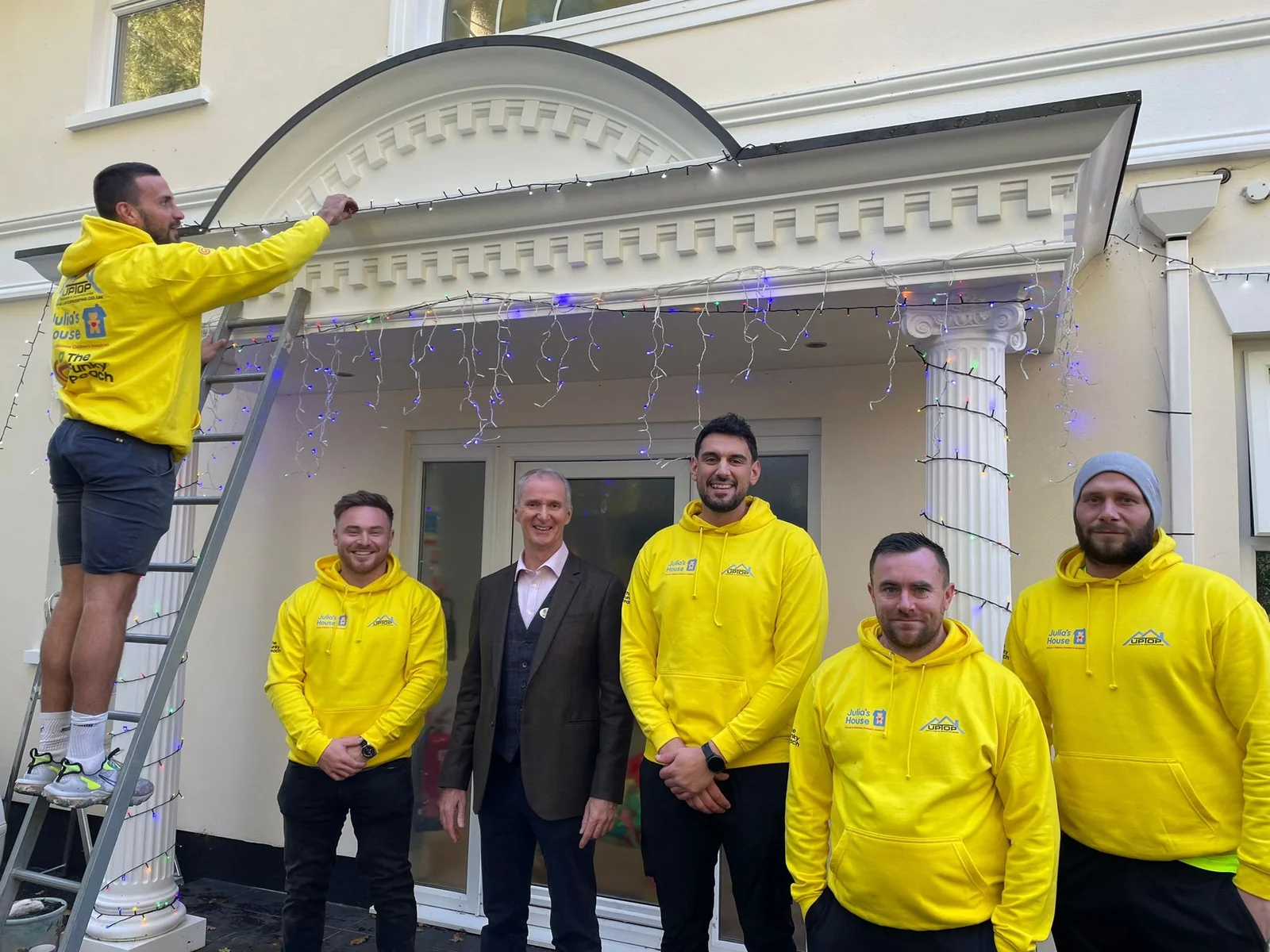 Up Top Roofing team supporting Julia's House Christmas lights in Dorset